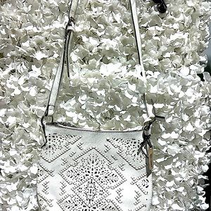 New purses by Coco & Carmen with a protective bag covering pull string